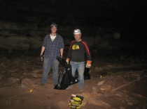 Kegan McClanahan and Phil Goldman filled up bags of trash inside Crumps Cave.