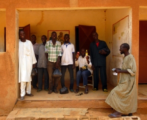 A group of Zerma and Fulani men showed the contents of their care packages they received after conducting eye-tracking trials in the village of Bassi. 
