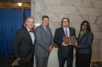 Michael Richmond (third from left) accepted the Kentucky Hall of Fame award on behalf of his former teacher Ronald Montgomery. Participating in the Feb. 6 presentation were (from left) WKU President Timothy C. Caboni, Kentucky Education Commissioner Stephen Pruitt and Lt. Gov. Jenean Hampton.
